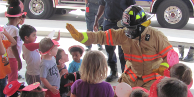 Fire Fighter Giving a High Five